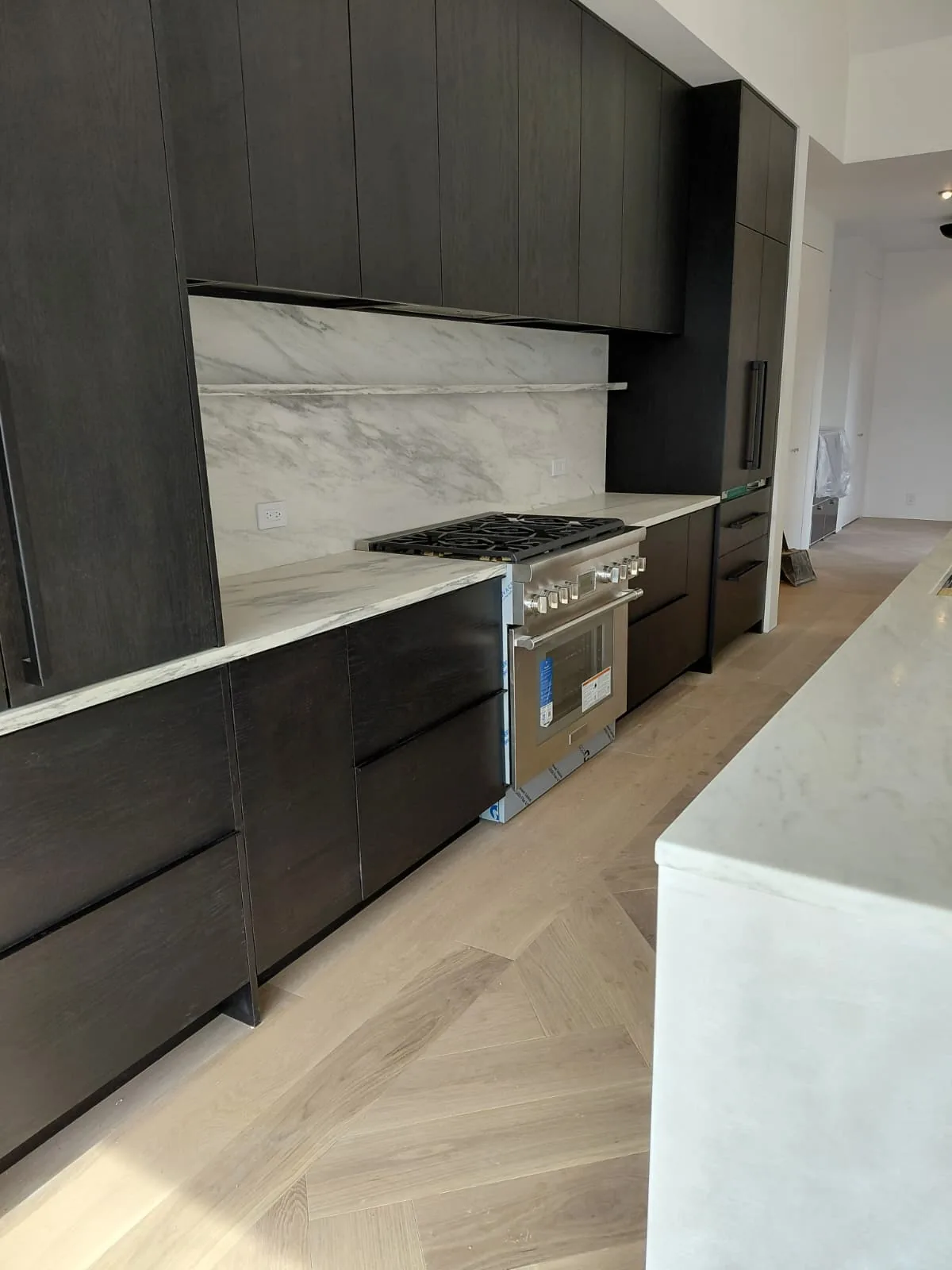 Kitchen with dark cabinets